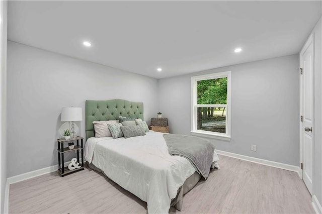 bedroom with light hardwood / wood-style flooring