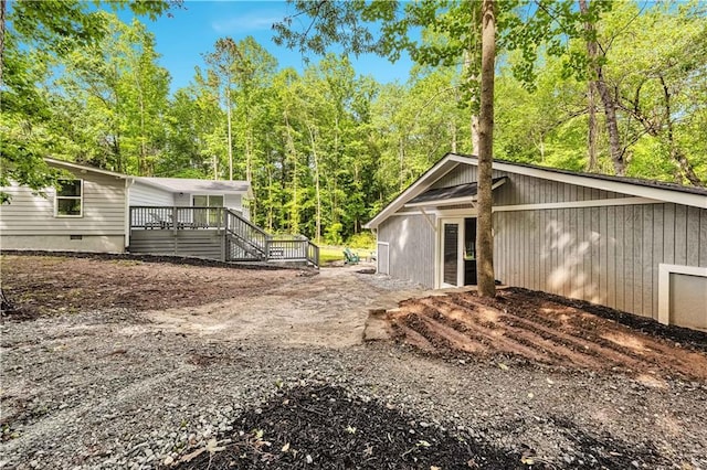 exterior space featuring a wooden deck