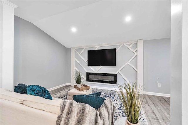 living room featuring vaulted ceiling and light wood-type flooring