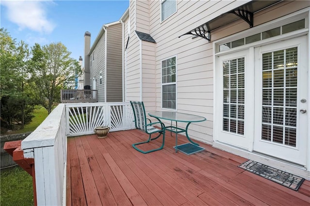 3460 Drayton Manor Run, Lawrenceville, GA 30046 - back of property with a deck, stairs, and a chimney