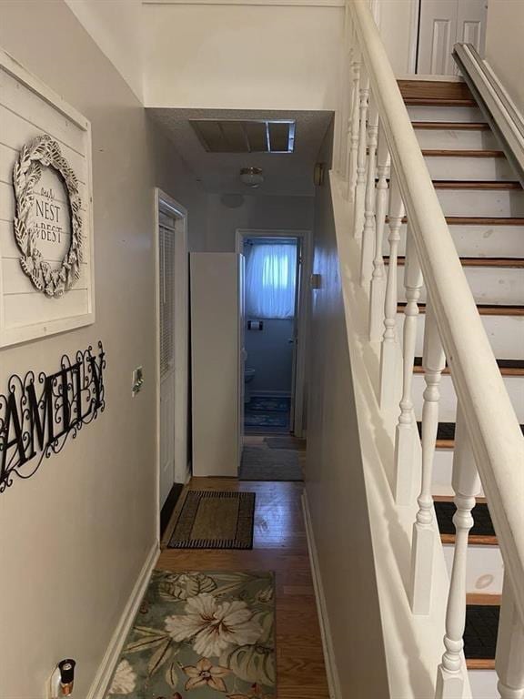 hall featuring dark wood-type flooring