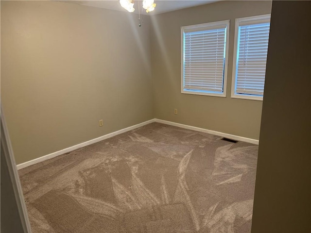 spare room with carpet floors