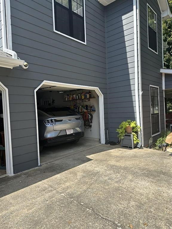 view of side of home with a garage