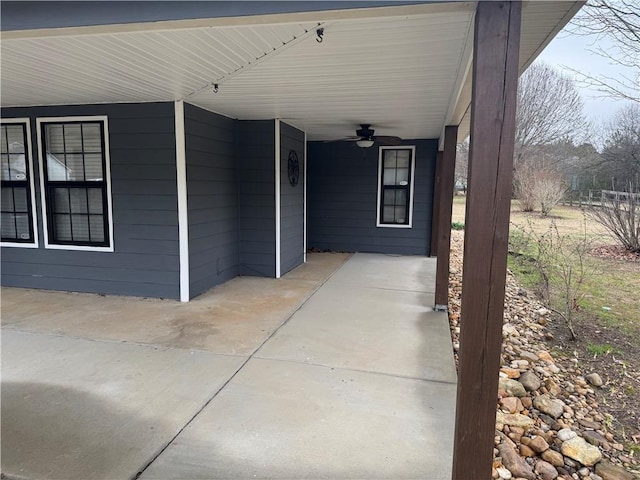 exterior space featuring ceiling fan