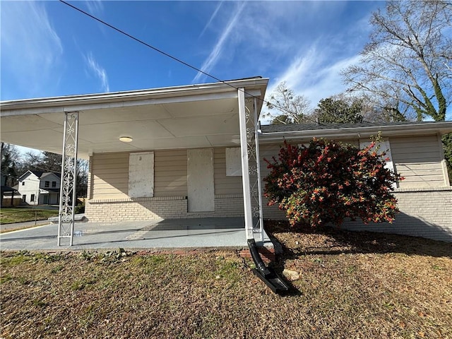 rear view of house with covered porch