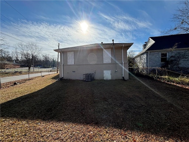 rear view of property featuring central AC unit