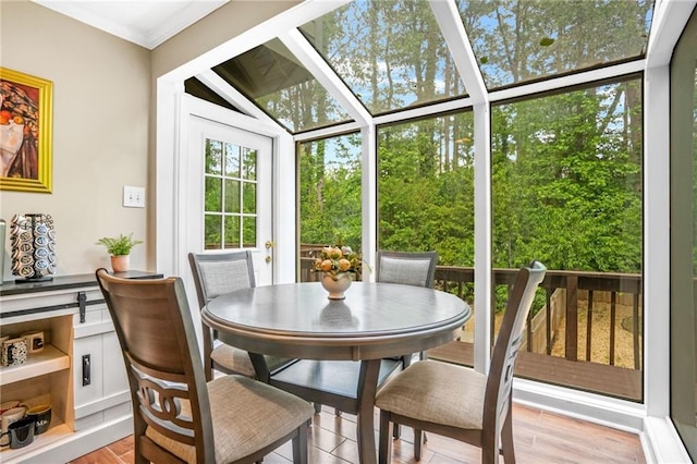 sunroom with outdoor dining space