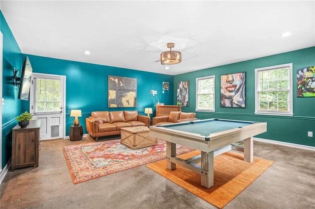 recreation room featuring baseboards, a wealth of natural light, pool table, and concrete floors