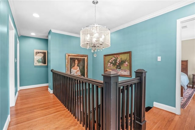 hall featuring an upstairs landing and baseboards