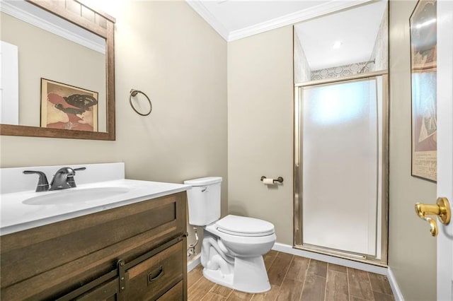 full bathroom with toilet, wood finished floors, a stall shower, vanity, and ornamental molding