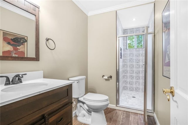 full bathroom with crown molding, toilet, wood finished floors, and a stall shower