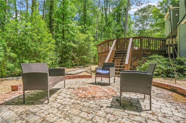 view of patio with stairway and a wooden deck
