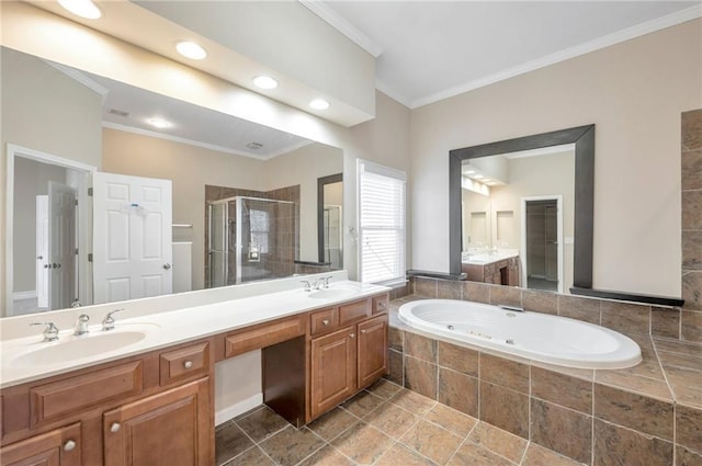 bathroom featuring a shower stall, a whirlpool tub, crown molding, and a sink