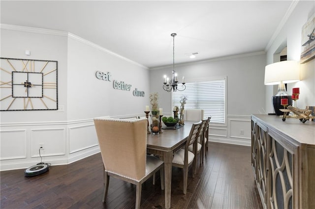 176 Red Wood Dr, Dallas, GA 30132 - dining space featuring crown molding, a chandelier, dark wood finished floors, and a decorative wall