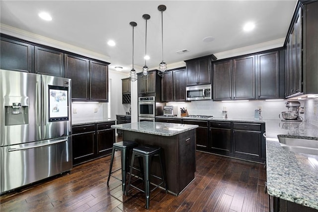 176 Red Wood Dr, Dallas, GA 30132 - kitchen with a kitchen island, light stone countertops, stainless steel appliances, and tasteful backsplash