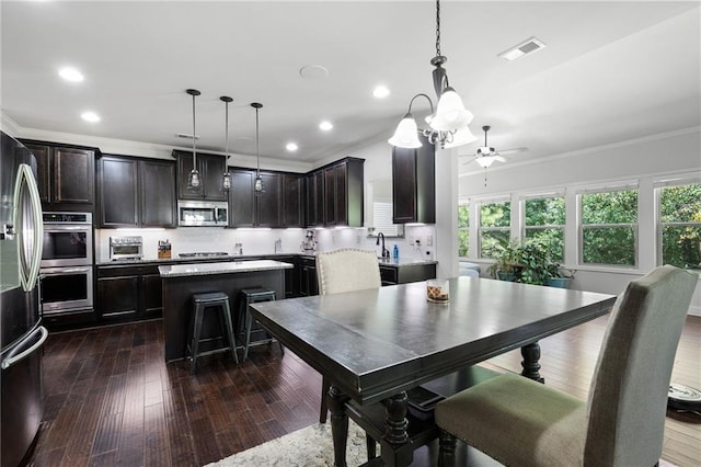 176 Red Wood Dr, Dallas, GA 30132 - dining area with crown molding, a ceiling fan, recessed lighting, and visible vents