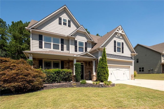 176 Red Wood Dr, Dallas, GA 30132 - craftsman inspired home featuring an attached garage, a front lawn, driveway, and stone siding