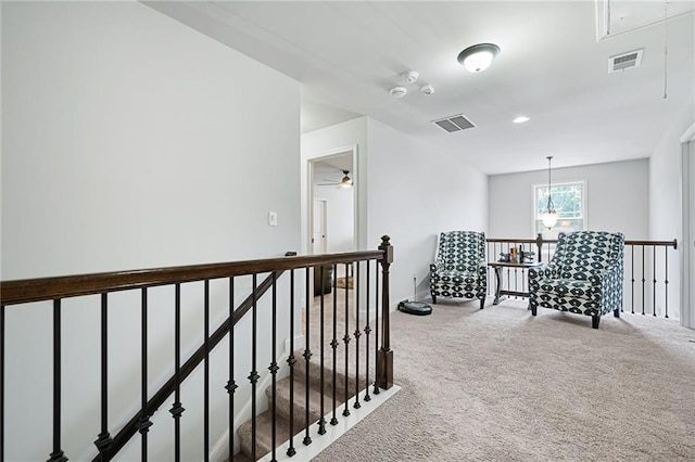 176 Red Wood Dr, Dallas, GA 30132 - corridor with carpet floors, visible vents, attic access, and an upstairs landing
