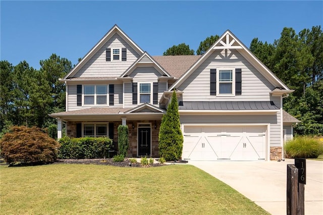 176 Red Wood Dr, Dallas, GA 30132 - view of front facade featuring an attached garage, driveway, a front lawn, and stone siding