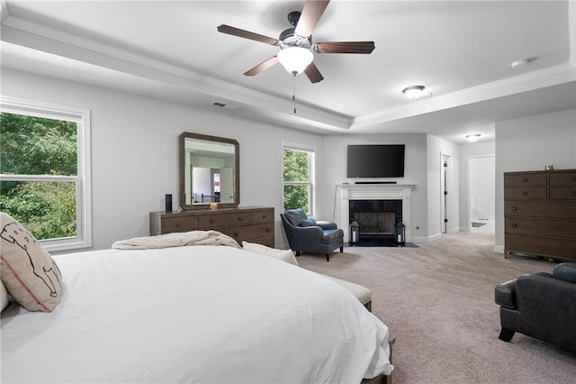 176 Red Wood Dr, Dallas, GA 30132 - carpeted bedroom with crown molding, visible vents, a fireplace with flush hearth, and a raised ceiling