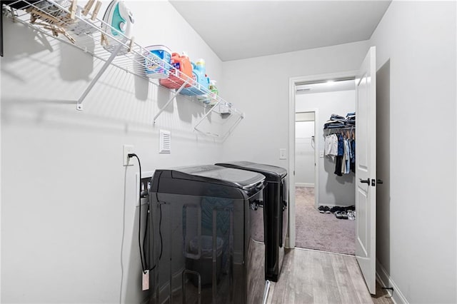 176 Red Wood Dr, Dallas, GA 30132 - laundry room featuring baseboards, laundry area, washing machine and dryer, and light wood finished floors