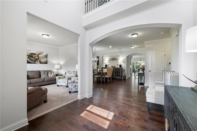 176 Red Wood Dr, Dallas, GA 30132 - foyer entrance with crown molding, arched walkways, baseboards, and wood finished floors