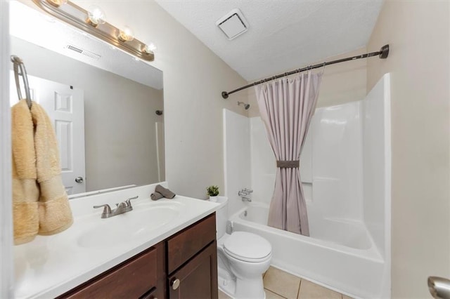 full bathroom featuring toilet, a textured ceiling, vanity, shower / bath combo, and tile patterned flooring