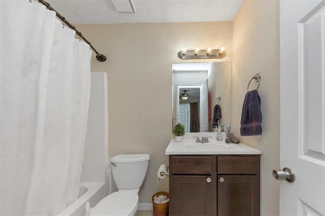 full bathroom featuring vanity, shower / bath combo, a textured ceiling, and toilet