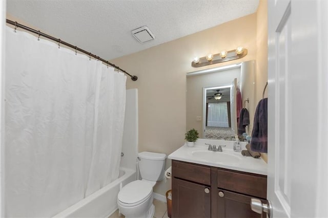 full bathroom with vanity, toilet, a textured ceiling, and shower / bath combo