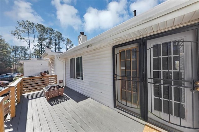 deck with an outdoor fire pit