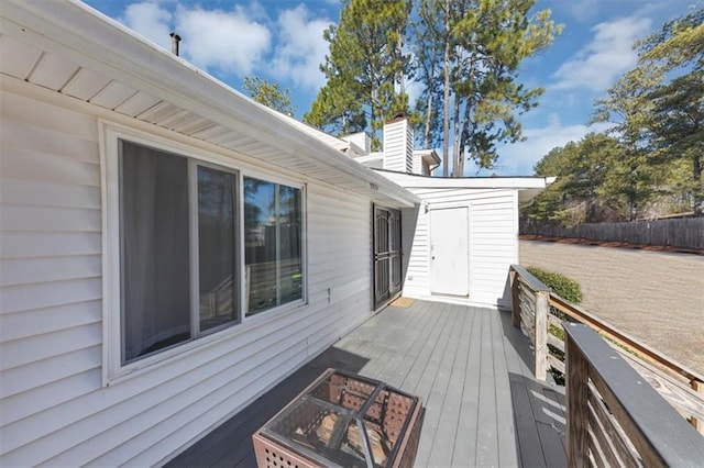 wooden deck featuring a fire pit