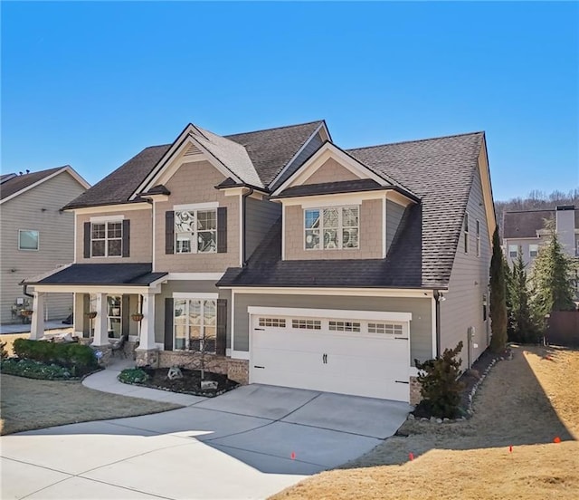 craftsman-style house featuring a garage and a porch