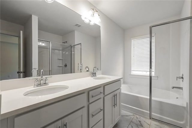 bathroom featuring a stall shower, a bath, visible vents, and a sink