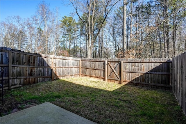 view of yard with a fenced backyard