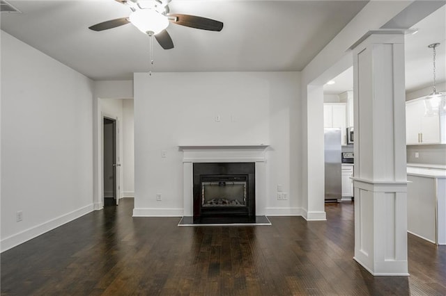 unfurnished living room featuring dark wood-style floors, visible vents, and a ceiling fan