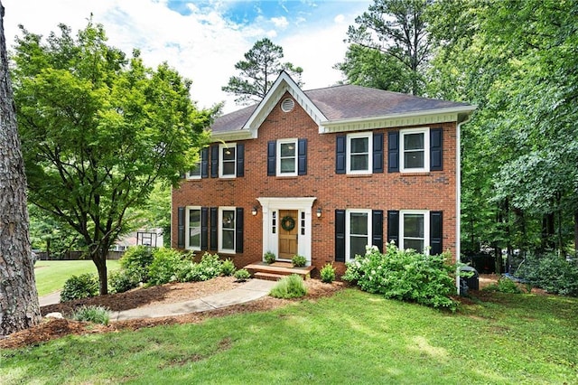 4522 Reva Ct NE, Marietta, GA 30066 - colonial-style house featuring a front yard and brick siding