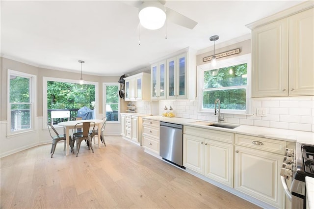 4522 Reva Ct NE, Marietta, GA 30066 - kitchen with appliances with stainless steel finishes, light wood-style floors, ornamental molding, glass insert cabinets, and decorative light fixtures