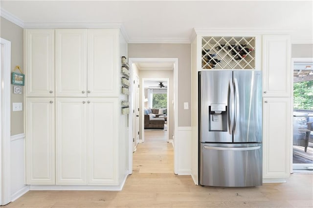 4522 Reva Ct NE, Marietta, GA 30066 - kitchen featuring stainless steel fridge, light wood finished floors, crown molding, healthy amount of natural light, and white cabinetry