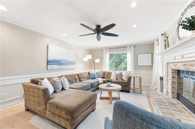4522 Reva Ct NE, Marietta, GA 30066 - living area with ornamental molding, wainscoting, a fireplace, recessed lighting, and ceiling fan