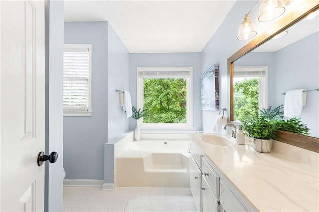 4522 Reva Ct NE, Marietta, GA 30066 - full bath with vanity, a garden tub, a textured ceiling, and tile patterned floors