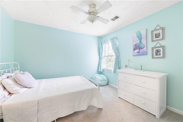 4522 Reva Ct NE, Marietta, GA 30066 - bedroom featuring light carpet, ceiling fan, and a textured ceiling