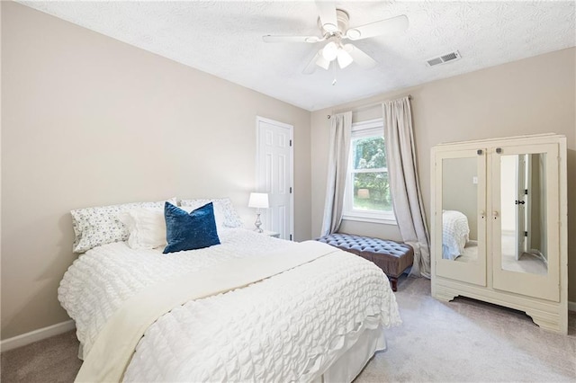 4522 Reva Ct NE, Marietta, GA 30066 - bedroom with carpet, ceiling fan, and a textured ceiling