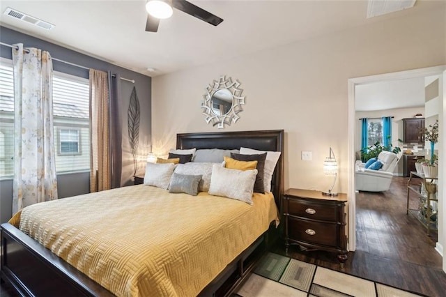 bedroom featuring ceiling fan and wood-type flooring