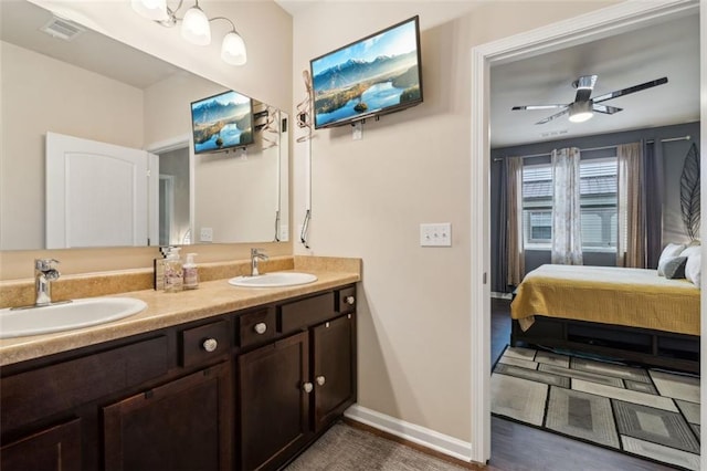 bathroom with vanity and ceiling fan