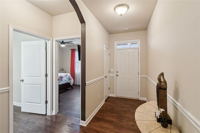 entrance foyer with plenty of natural light and dark hardwood / wood-style floors