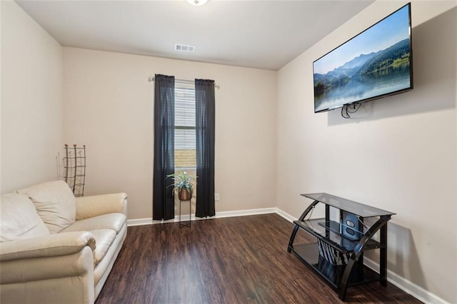 sitting room featuring dark hardwood / wood-style floors