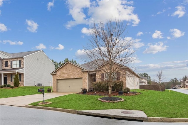 view of front of home with a garage, central AC, and a front lawn