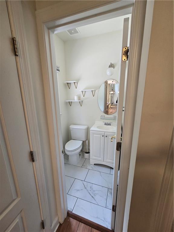 2670 Henderson Chase Ct, Tucker, GA 30084 - bathroom featuring marble look tiles and vanity
