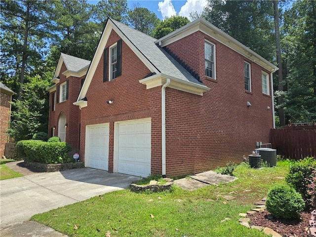 2670 Henderson Chase Ct, Tucker, GA 30084 - view of side of property featuring a garage, driveway, brick siding, and roof with shingles