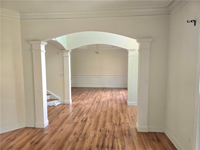 2670 Henderson Chase Ct, Tucker, GA 30084 - hallway featuring arched walkways, ornate columns, ornamental molding, wood finished floors, and stairway
